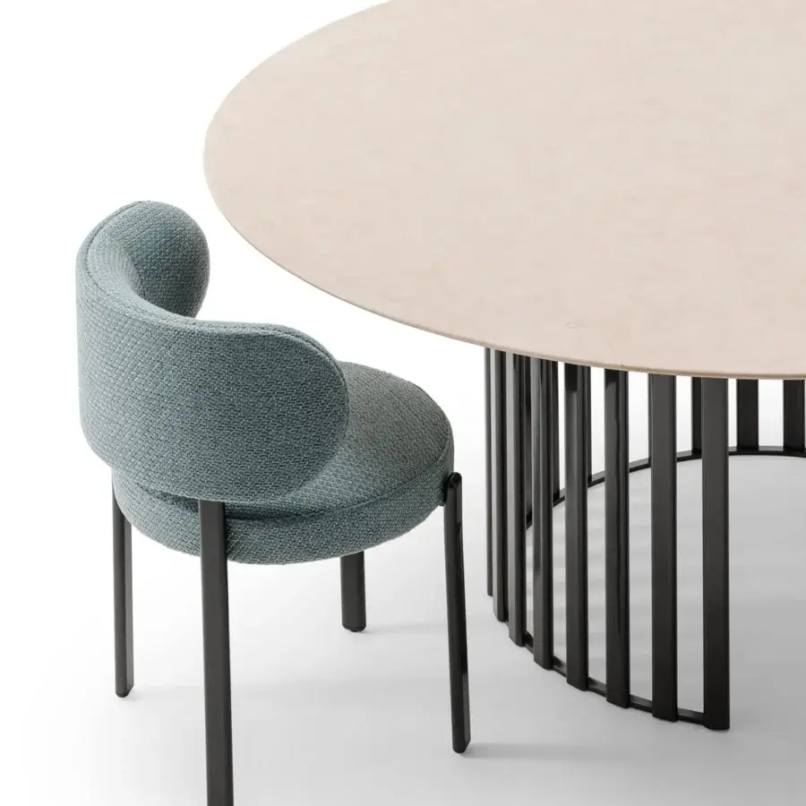 Captivating Turri Roma table with a circular base built in vertically arranged metal and a light beige matte composite top