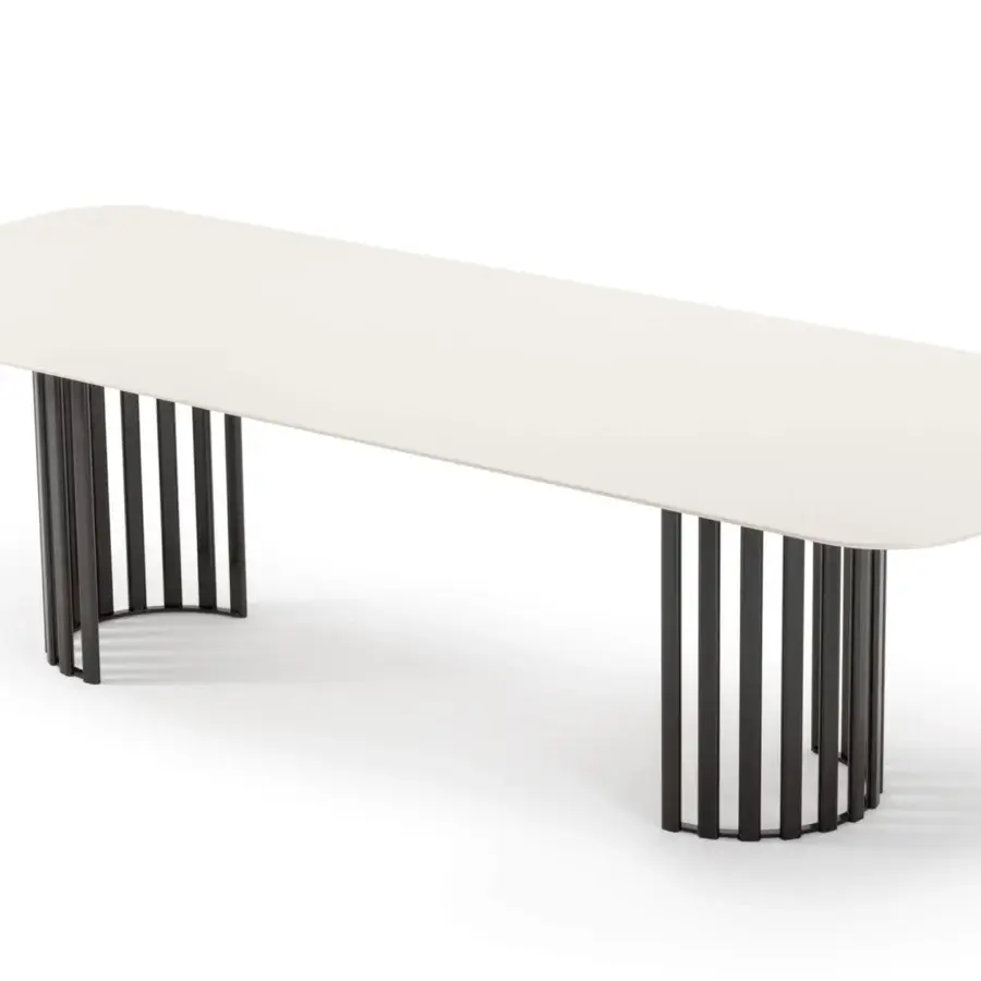 Elegant Turri Roma table with a light matte top and robust black metal bases in a partial circle