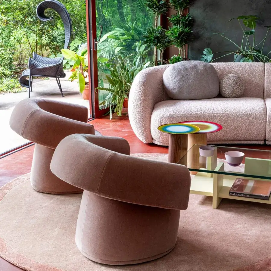 Harmonious Moroso Ruff lounge chair upholstered in blush textile with matte finish and curved lines