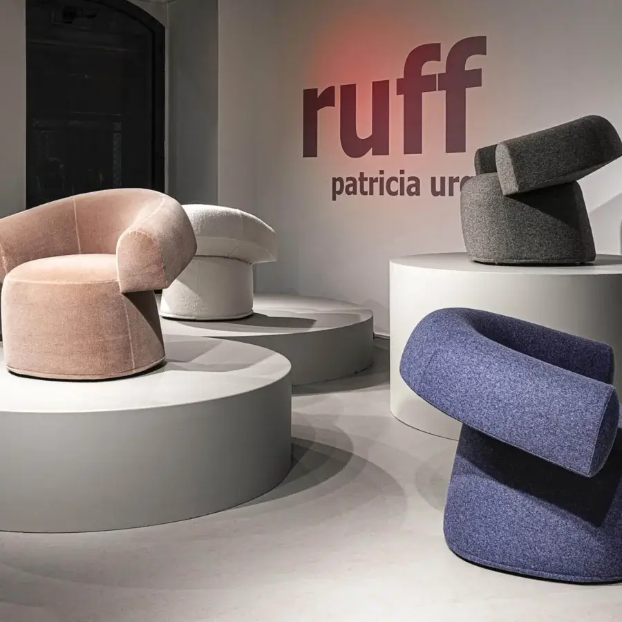 Exceptional Moroso Ruff lounge chair with curved geometric form upholstered in matte pink textile and transparent PVC glides