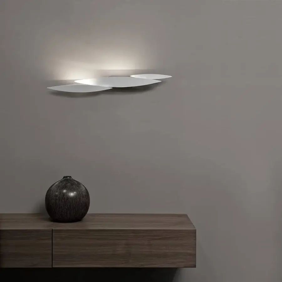 Innovative Terzani I Lucci Argentati wall lamp recalling a school of fish with sleek metal construction and white polished finish