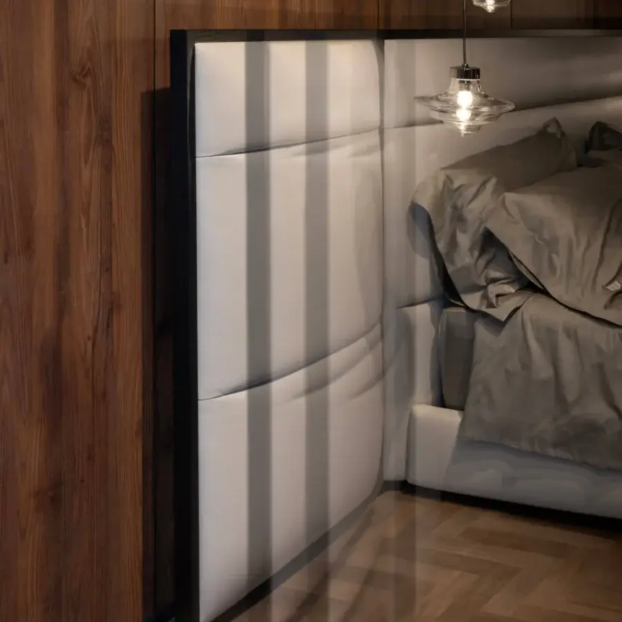 Distinguished WAYNE Enterprises WE-075 bed with light grey synthetic leather, vertical tufting and dark wood veneer framing a matte finish