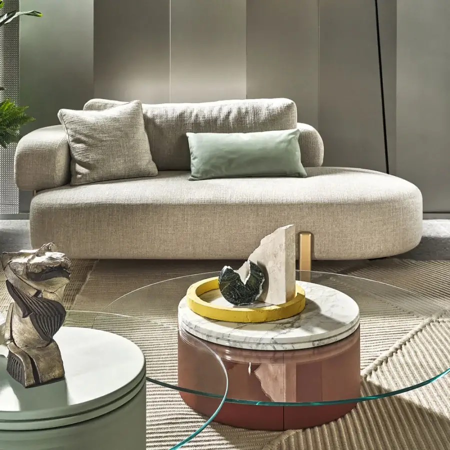 Innovative Turri Roma coffee table with cylindrical light green leather base and cantilevered crystal top