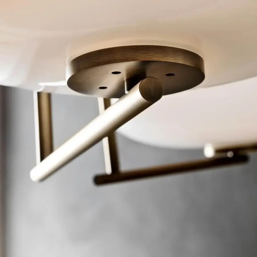 Distinguished Penta Mamì suspension lamp with a wide oval diffuser of white blown glass and brushed bronze metal support