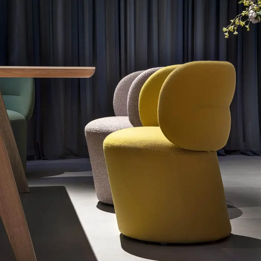 Exceptional Moroso Getlucky chair showcasing muted yellow textile with a slightly rough texture and contemporary form crafted in Italy