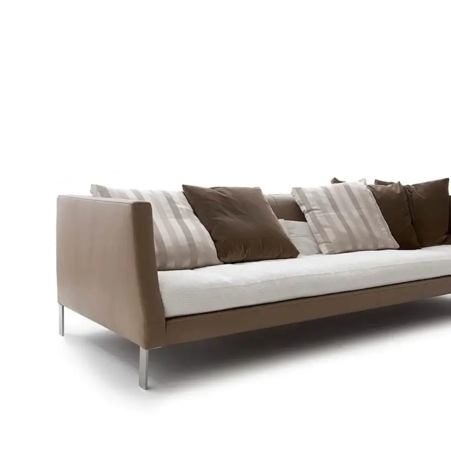 Lavish Erba Altoborgo sofa crafted in light brown leather-like material with satined chrome steel feet and textured white seat cushions