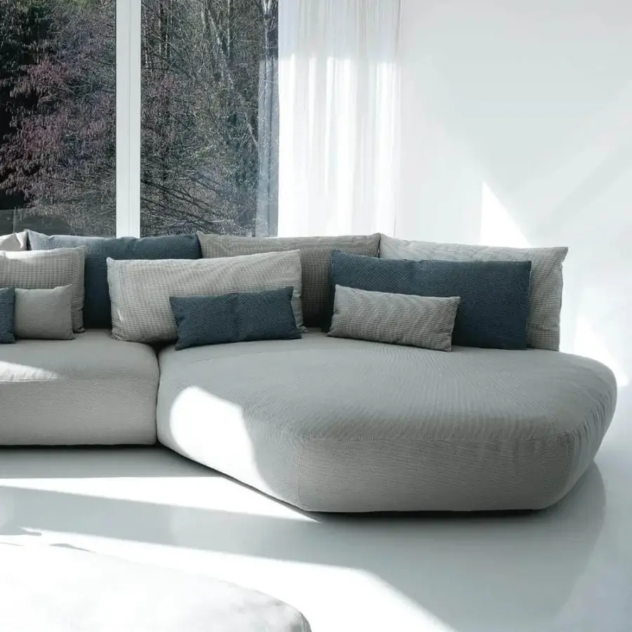 Superior Swan Italia Pack sectional with light gray fabric upholstery and plush feather cushions in coordinating tones