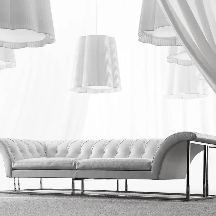 Exceptional Erba Rockouture sofa with light-toned textile upholstery and bright stainless steel base crafted in Italy