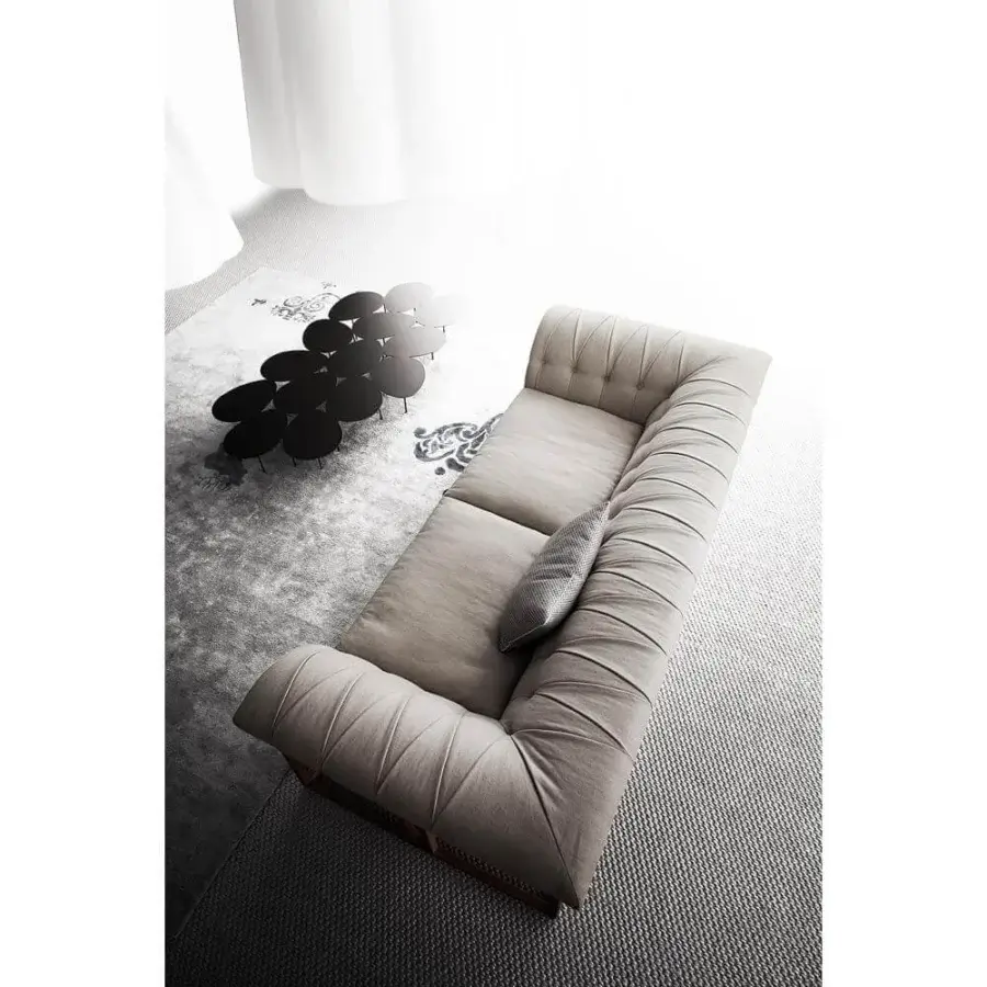 Distinguished Erba Rockouture sofa, a light beige Italian design with tufted detailing and bright finish stainless steel base