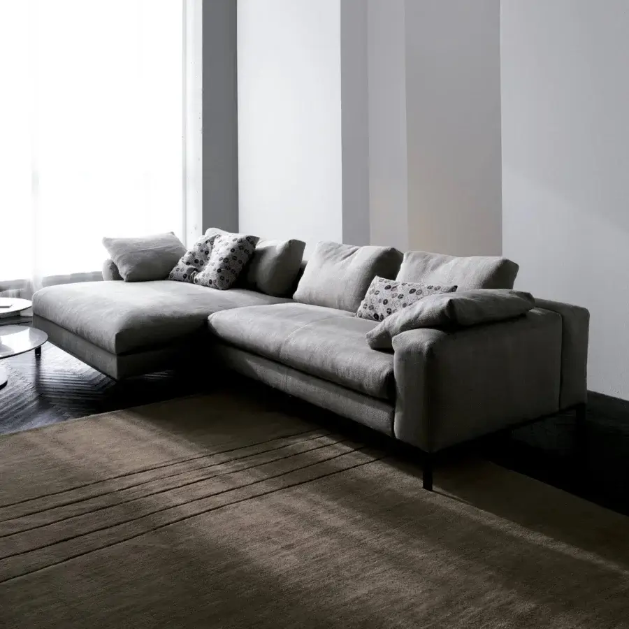 Elegant Swan Italia Molvedo sectional with removable luxurious gray fabric and matte finish atop brown-bronze metal feet