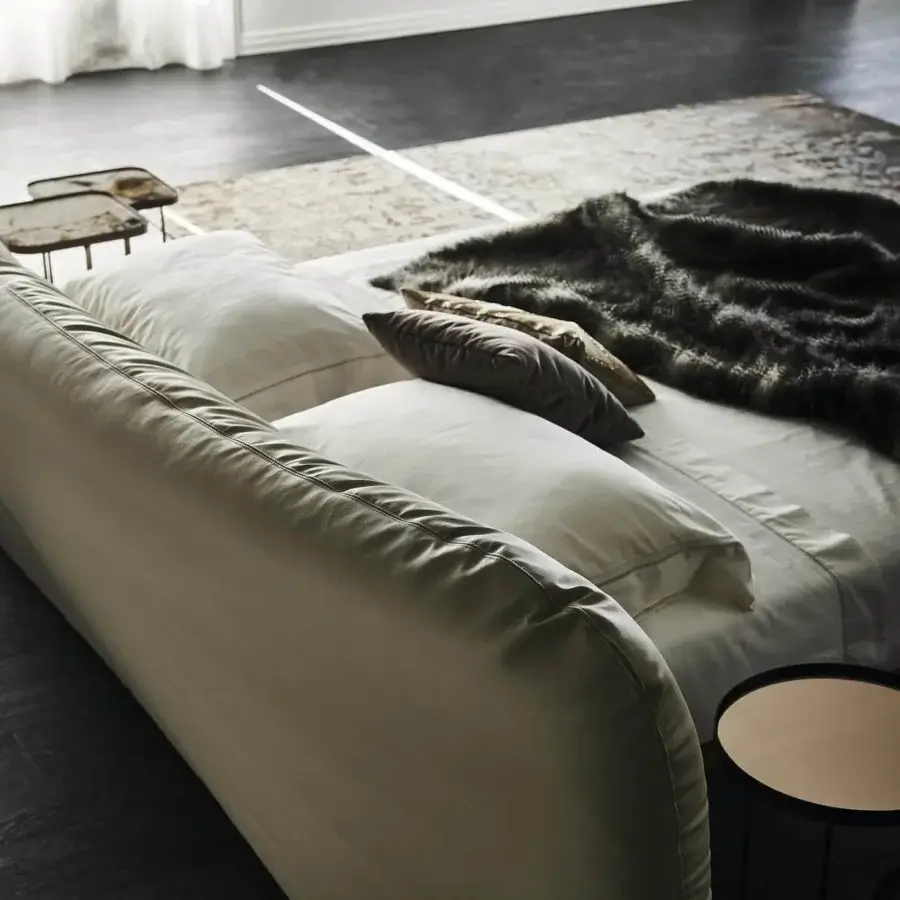 Refined Cattelan Italia Marlon bed with a Canaletto walnut frame and light beige textile headboard exhibiting stitched detailing