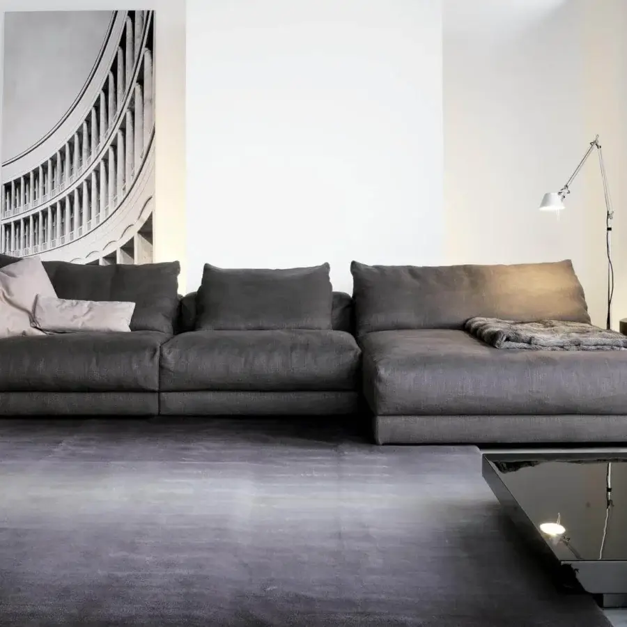 Distinguished Swan Italia Hills sectional with dark gray textile upholstery and powder coated metal feet crafted in Italy
