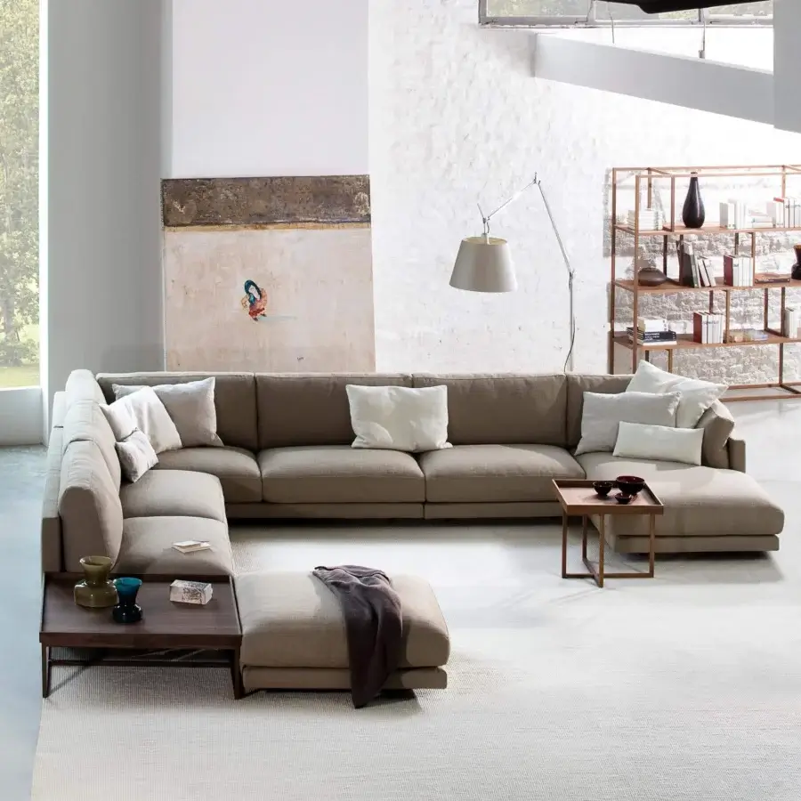 Elegant Swan Italia Host sectional with textured matte textile upholstery and powder-coated metal feet