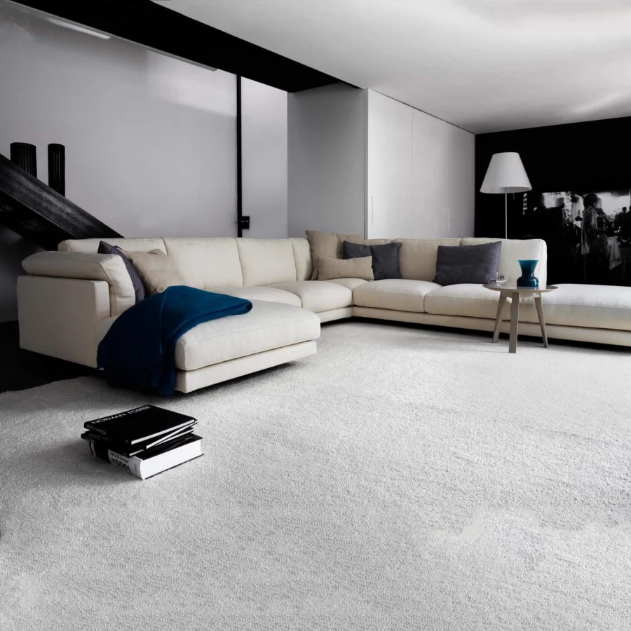 Distinguished Swan Italia Host sectional with light cream fabric upholstery and powder-coated metal feet