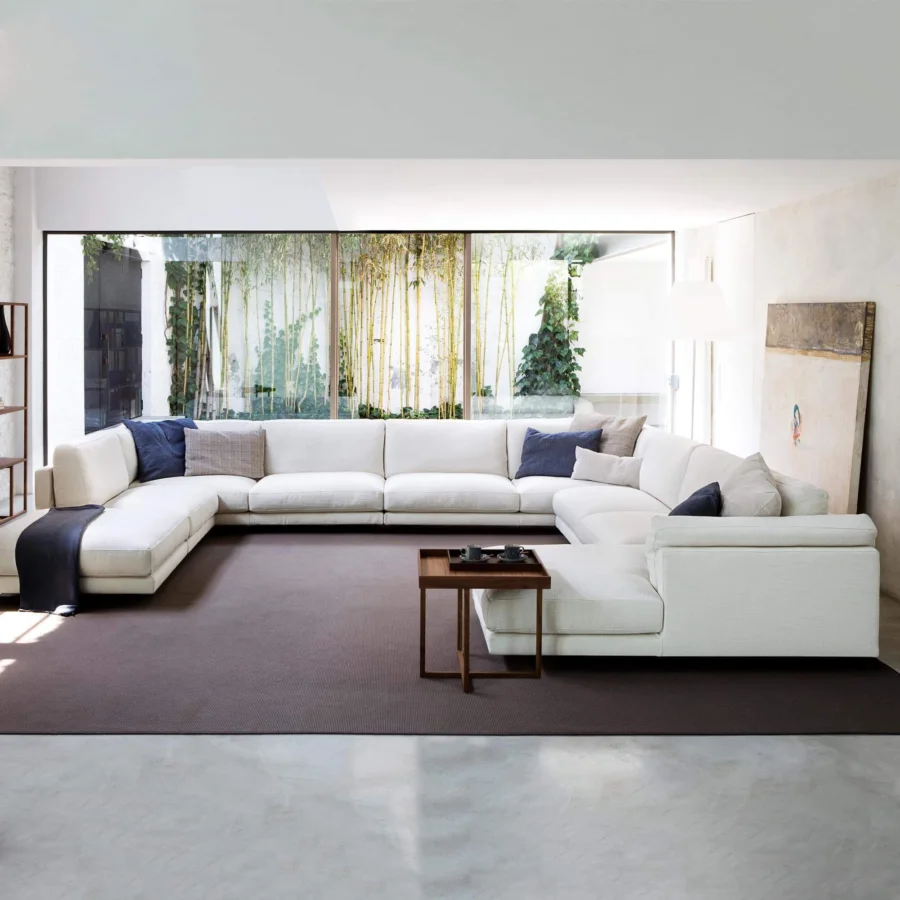 Distinguished Swan Italia Host sectional with matte off-white fabric, powder-coated metal feet and navy neutral cushions