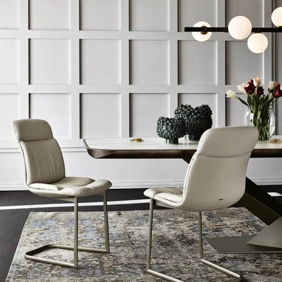 Distinguished Cattelan Italia Radja rug crafted in cotton and chenille with interwoven shapes and aged appearance