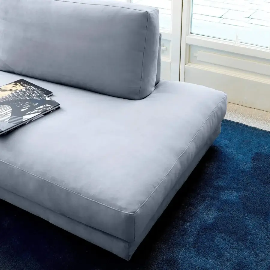 Superior Swan Italia host sofa with light gray matte textile upholstery and powder-coated metal feet