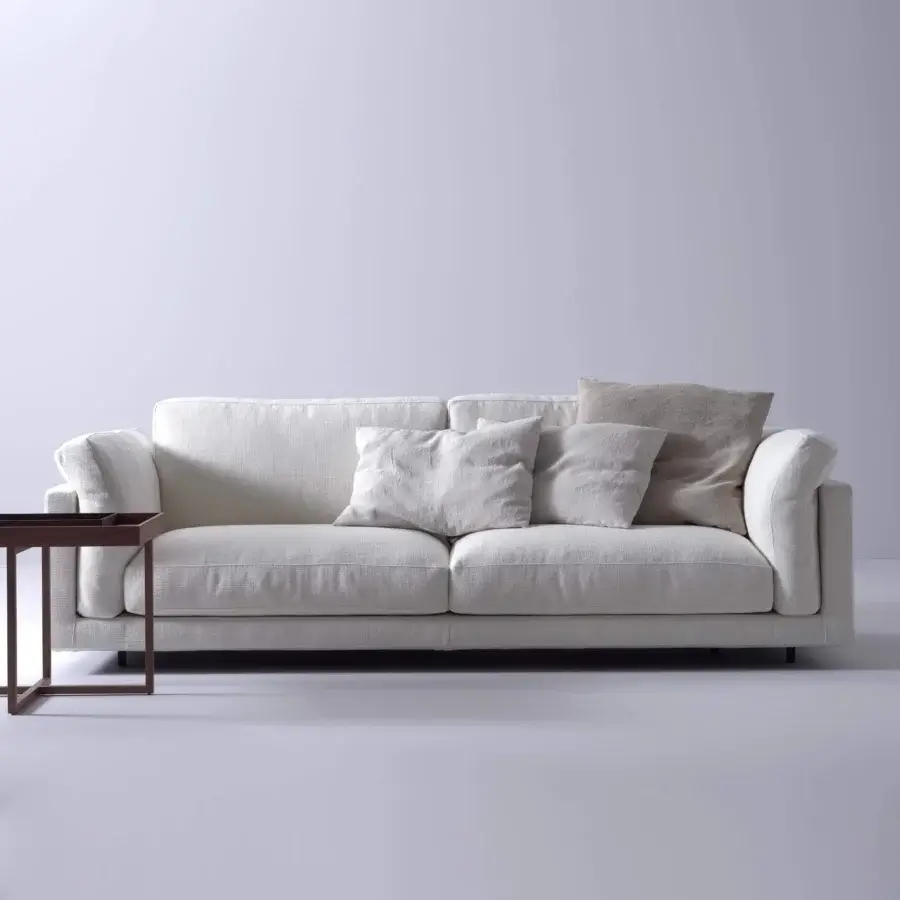Lavish Swan Italia host sofa with light textured fabric upholstery and powder-coated metal feet