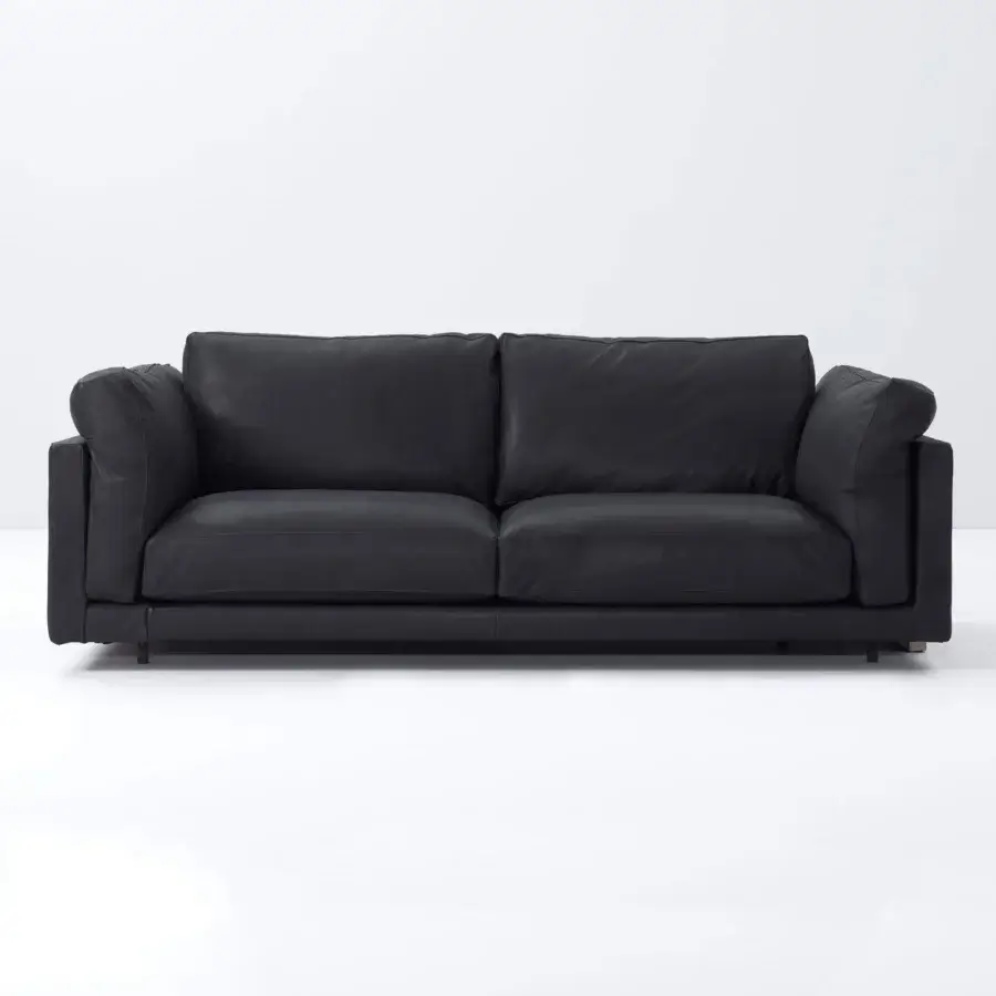 Superior Swan Italia Host sofa with plush rounded cushions in dark matte textile and powder-coated metal feet
