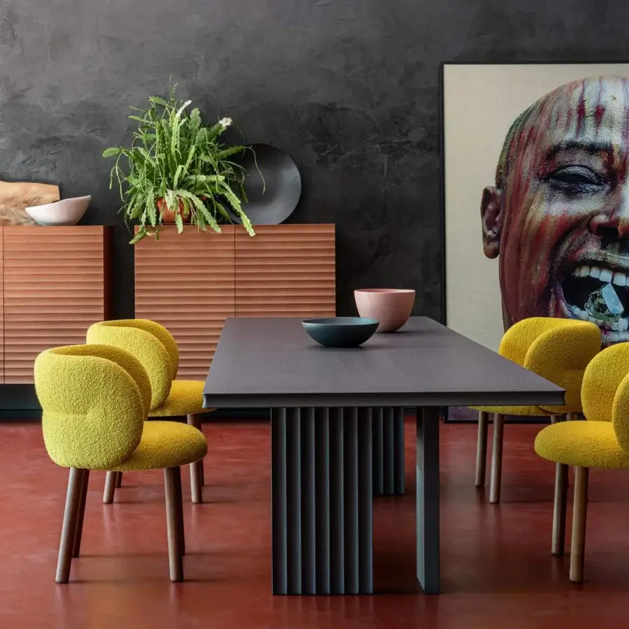 Lavish Moroso Getlucky chair with bright yellow textured textile upholstery and varnished ash wood legs