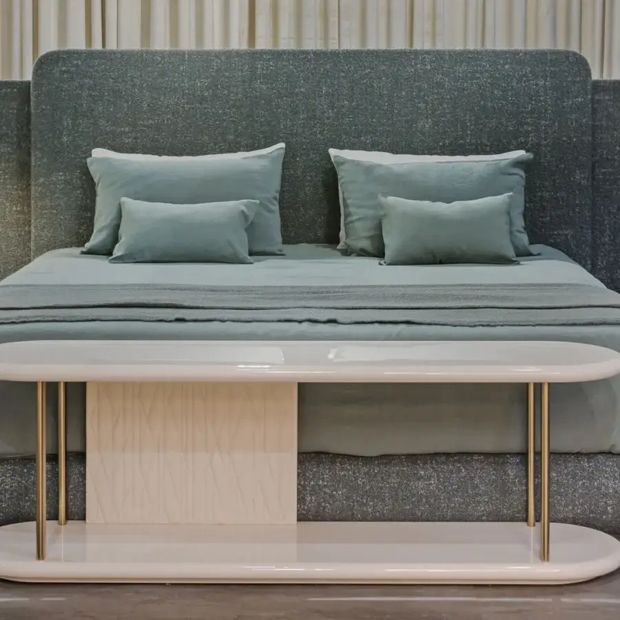 Exclusive Turri Roma bed with fabric or leather upholstery and brass-colored table exhibiting an organic glossy finish