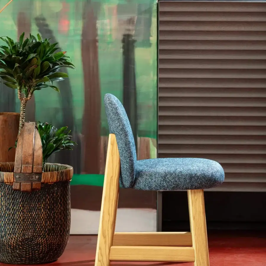 Exceptional Moroso Pheaby chair with painted ash structure and softly-rounded seat upholstered in speckled blue textile with matte finish