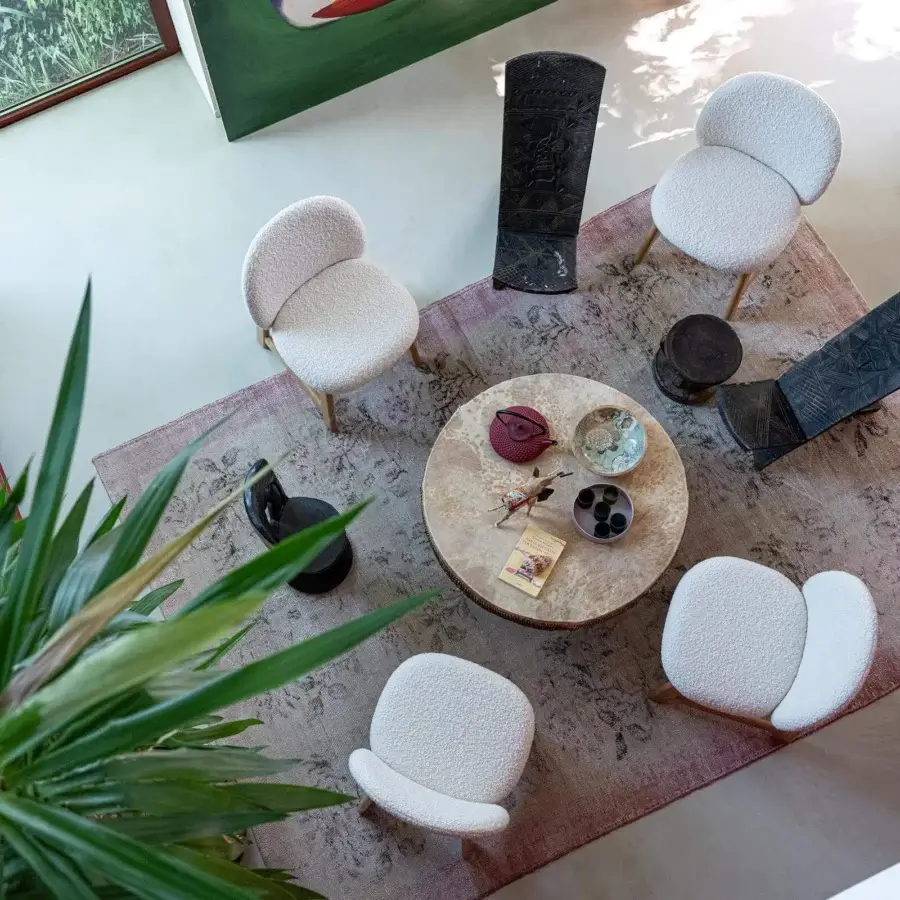 Distinguished Moroso Pheaby chair built in painted ash with softly-rounded seating upholstered in fluffy white fabric