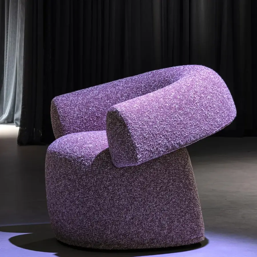 Distinguished Moroso Ruff lounge chair upholstered in textured purple and white textile with a nubby finish