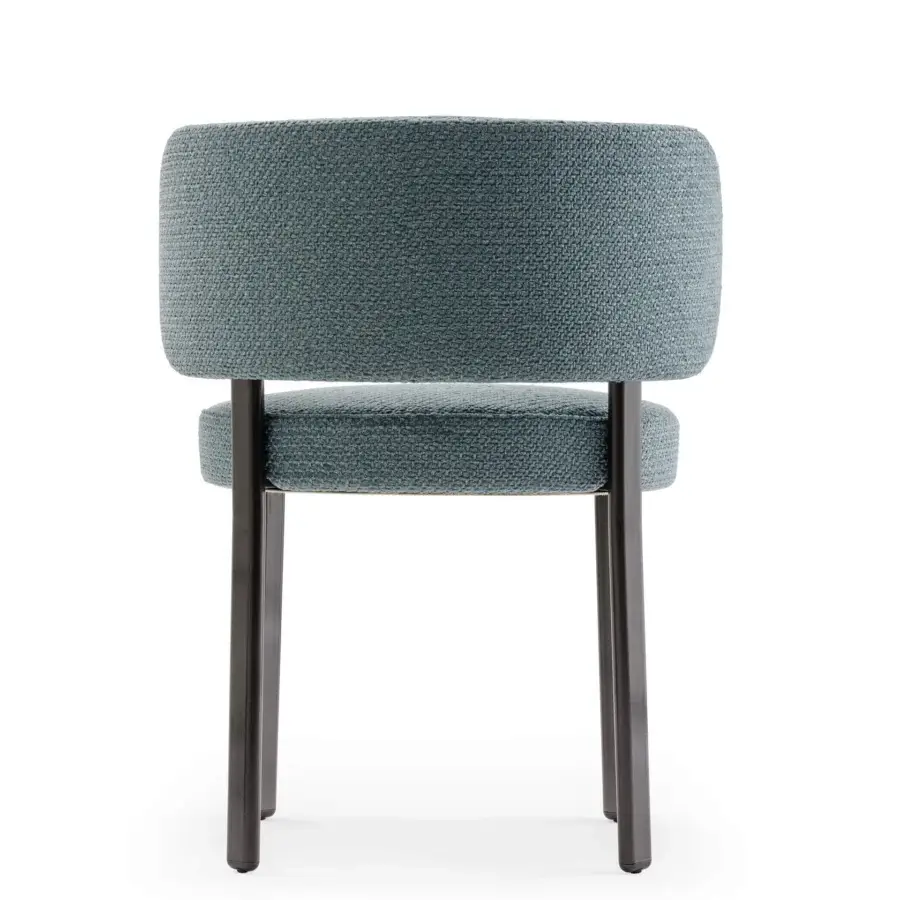 Distinguished Turri Roma chair with muted blue-green woven textile upholstery and dark matte metal legs