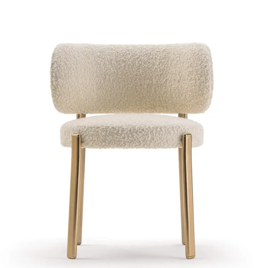 Distinguished Turri Roma chair with a rounded silhouette upholstered in cream-colored textile and reflective gold-finished metal legs