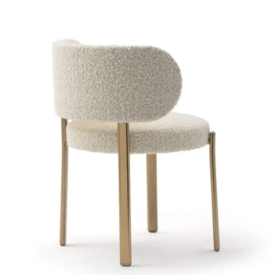 Distinguished Turri Roma chair with rounded form upholstered in textured light cream bouclé and satin golden metal legs