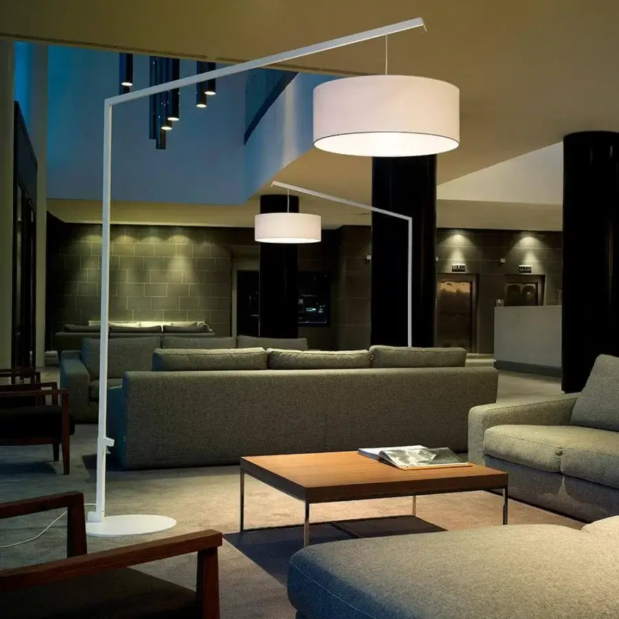 Superior Modo Luce Angelica floor lamp with geometric embossed white painted metal and cylindrical cotton lampshade