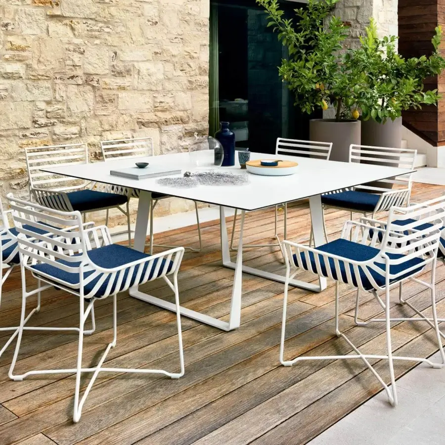 Superior Roberti Rattan Hamptons Graphics table with a square HPL top and powder-coated metal base in a matte white finish