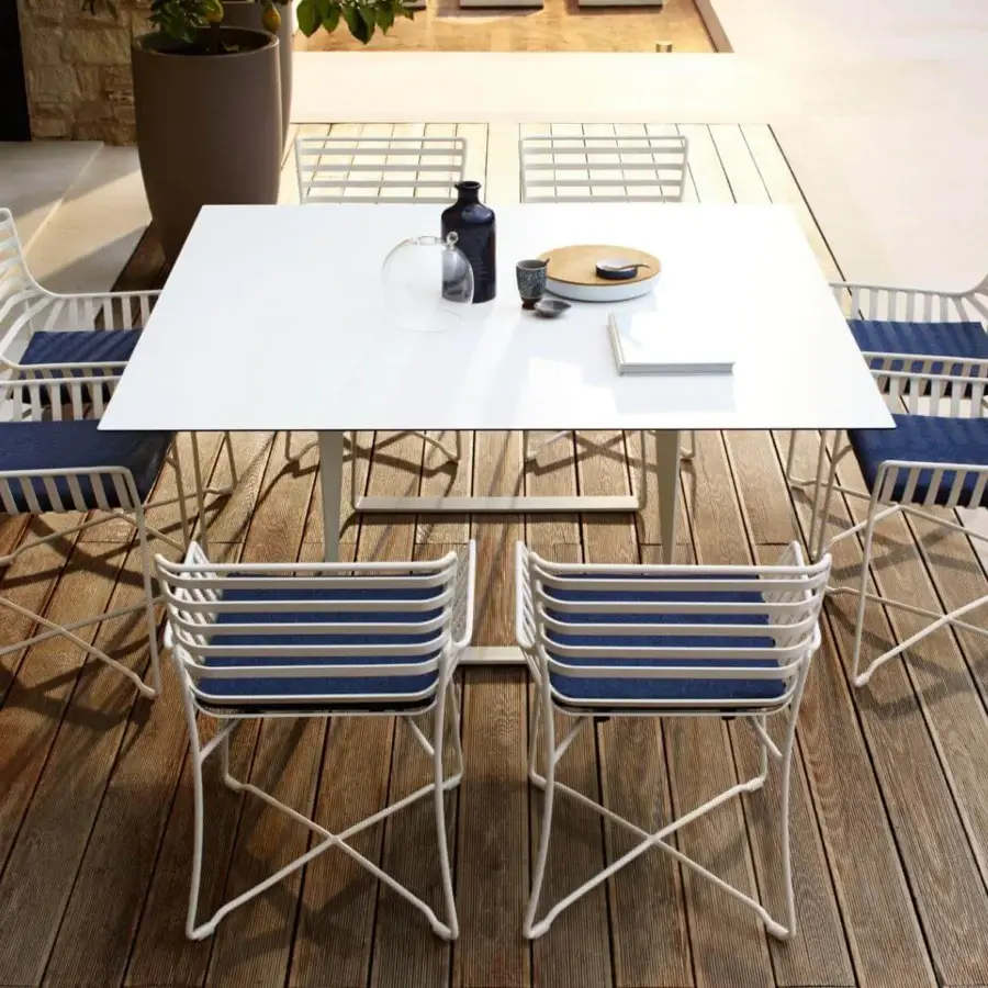 Sophisticated Roberti Rattan Hamptons Graphics table with a square HPL top and crisp white powder-coated metal base