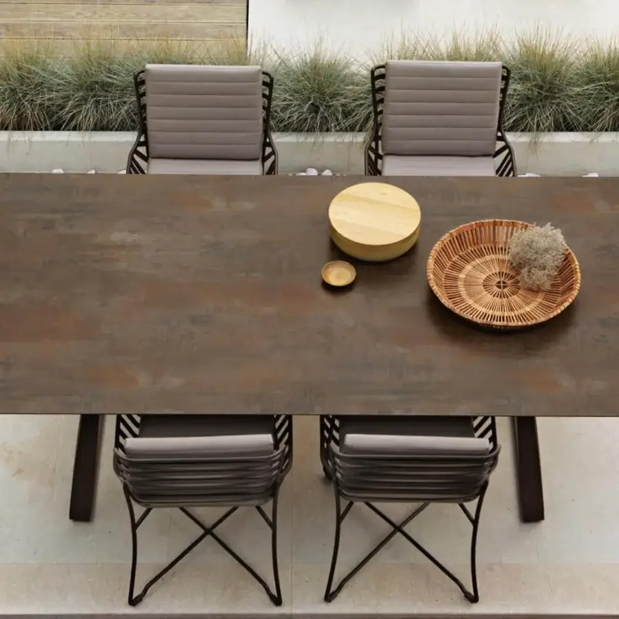 Exclusive Roberti Rattan Hamptons Graphics table with a square HPL top in dark brown textured finish and twisted metal base