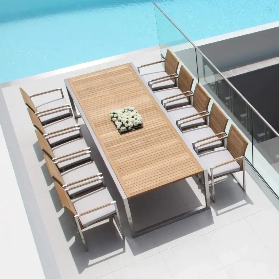 Distinguished Royal Botania Ninix table crafted with a brushed stainless steel frame and natural-toned wooden slats