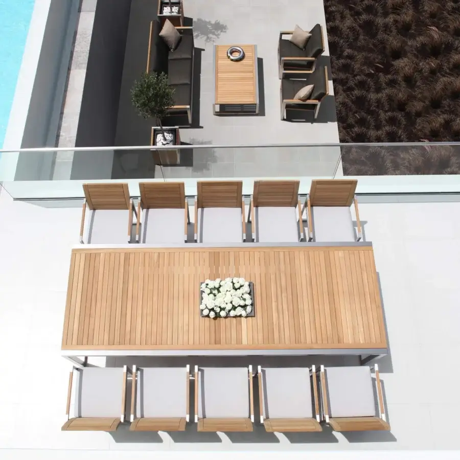 Sophisticated Royal Botania Ninix table built with planked wood and a brushed stainless steel frame offering a smooth finish