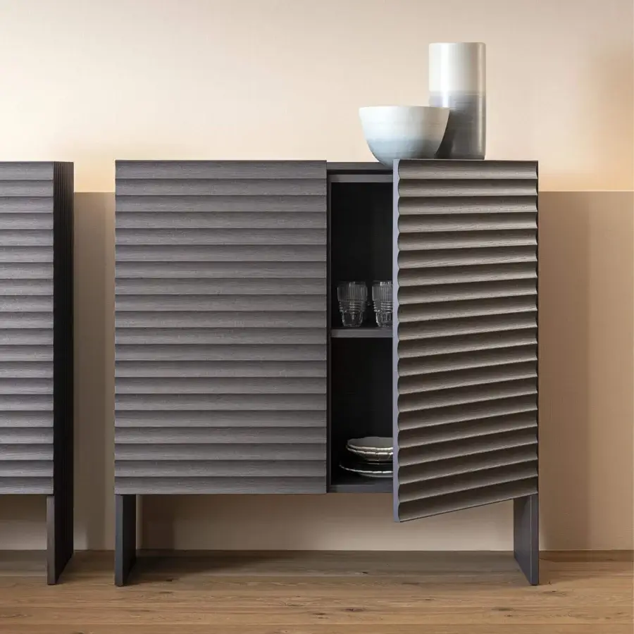 Distinguished Moroso Rows cupboard crafted with oak veneer and MDF, exhibiting a cool dark gray horizontally ridged finish