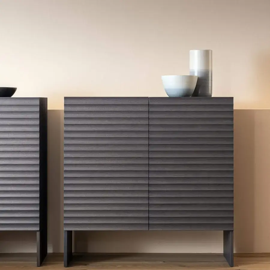 Superior Moroso Rows cupboard crafted with oak veneer and MDF, presenting horizontally ridged doors with a dark gray finish