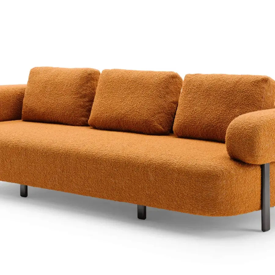 Distinguished Turri Roma sofa with warm orange textured textile and slender graphite gray metal feet