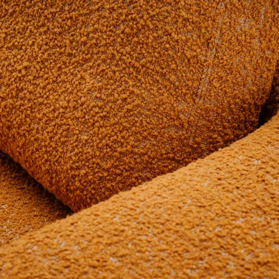 Sumptuous Turri Roma sofa with rounded silhouette, saturated orange looped textile and champagne gold metal feet