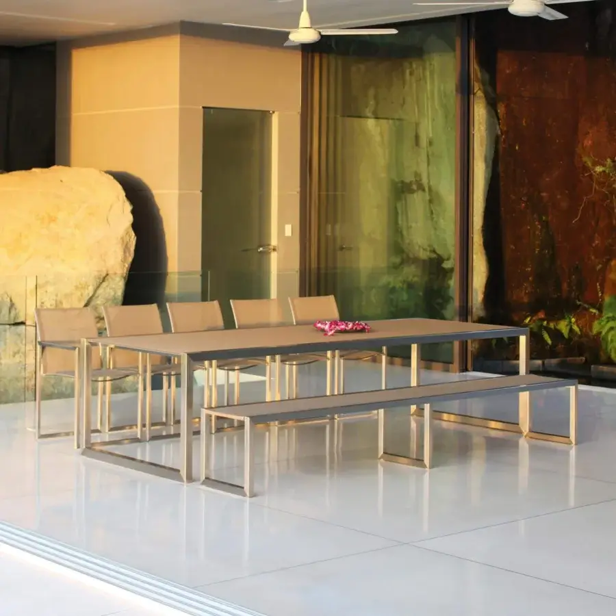 Distinguished Royal Botania Ninix table with a neutral tabletop and brushed stainless steel frame exhibiting clean lines