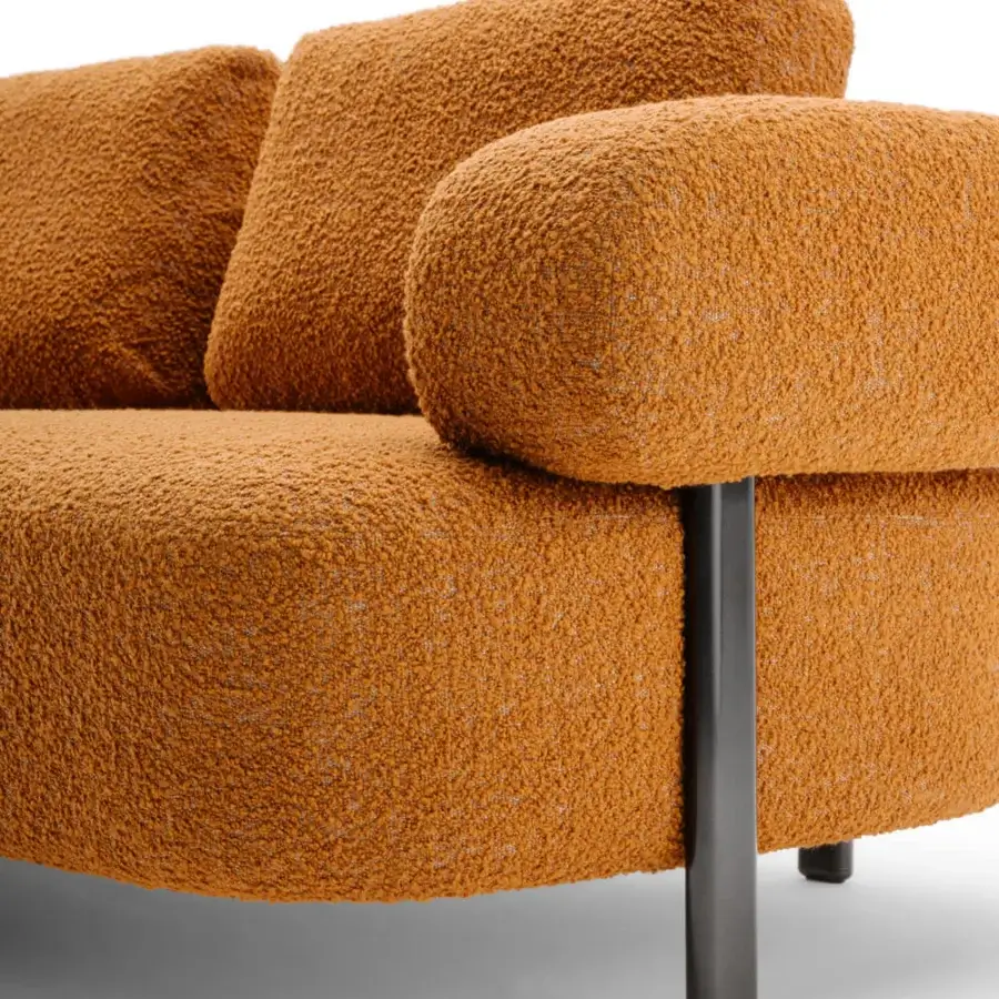 Superior Turri Roma sofa with generous seat enveloped in textured warm orange textile and sleek matte graphite gray metal legs