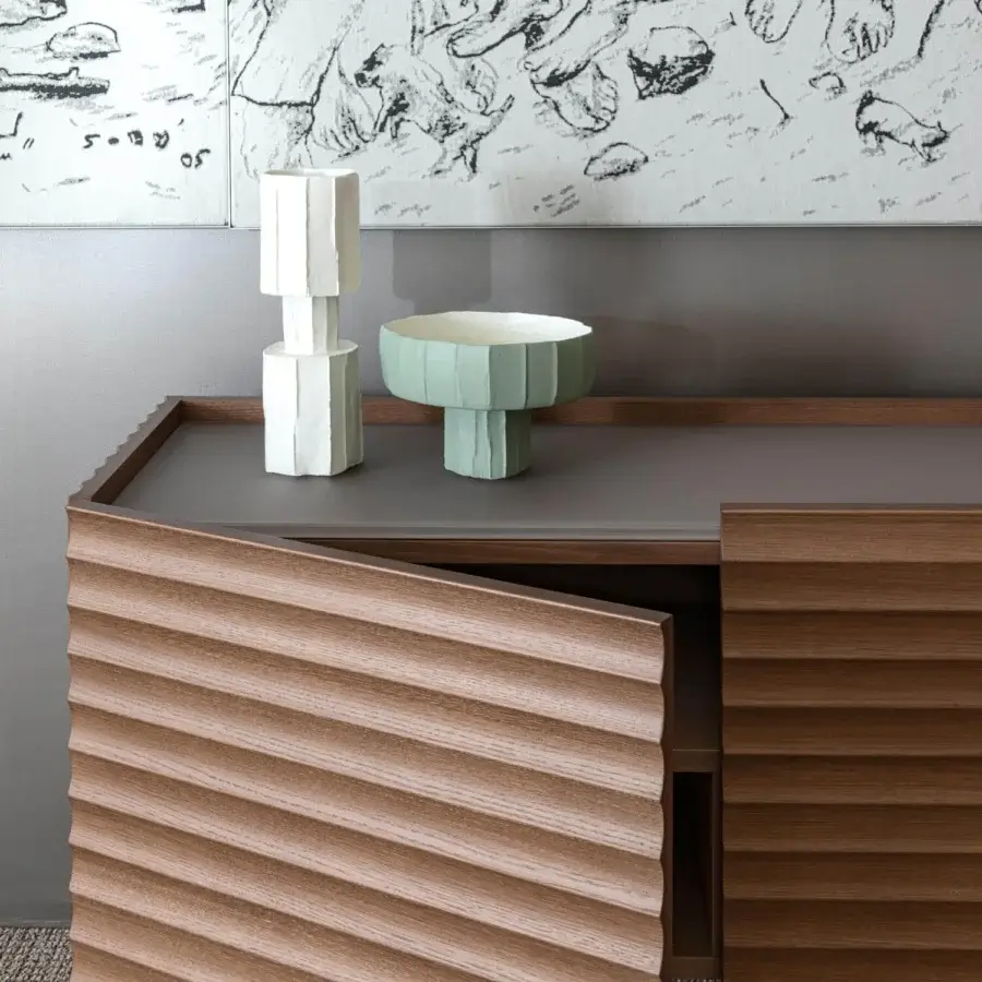 Elegant Moroso Rows sideboard crafted in oak veneer with medium brown finish and matte grey top displaying horizontal ribbed door fronts