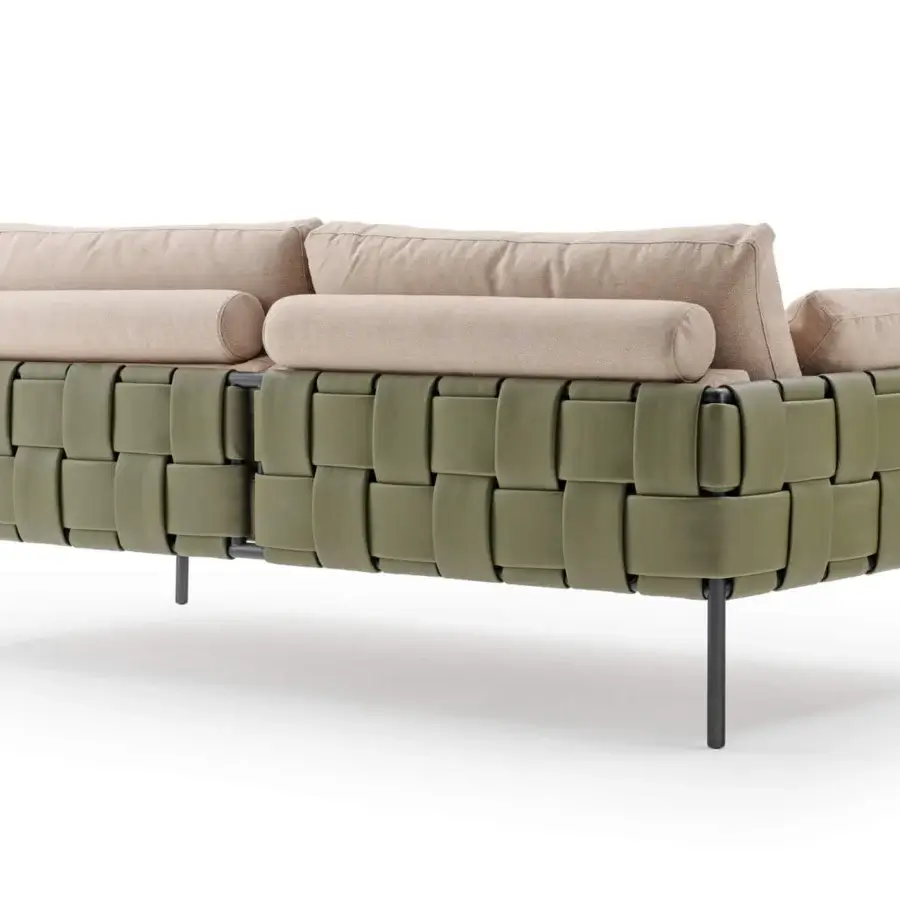 Captivating Turri Ratio sofa with woven olive-green base and light beige high-end textile upholstery crafted with thin dark metal legs