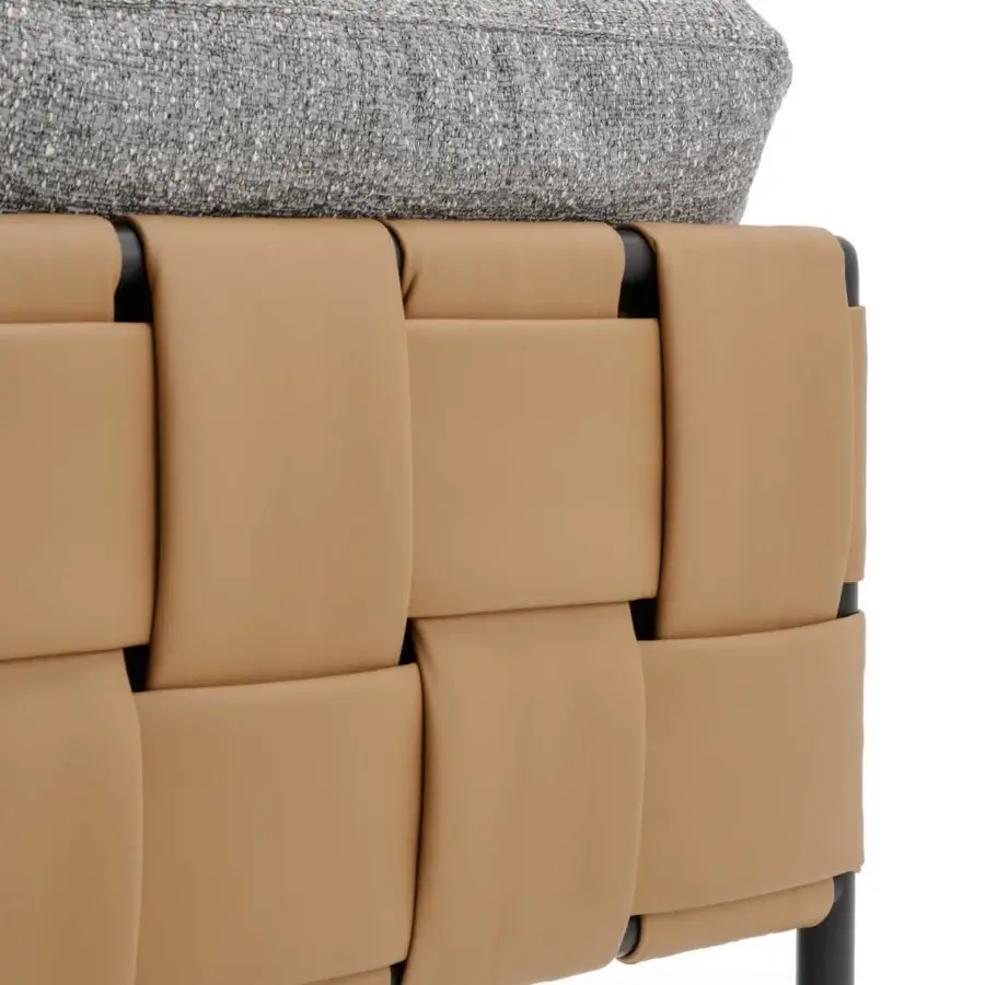 Elegant Turri Ratio sofa with woven tan leather, dark metal framing and a textured gray cushion for exceptional comfort