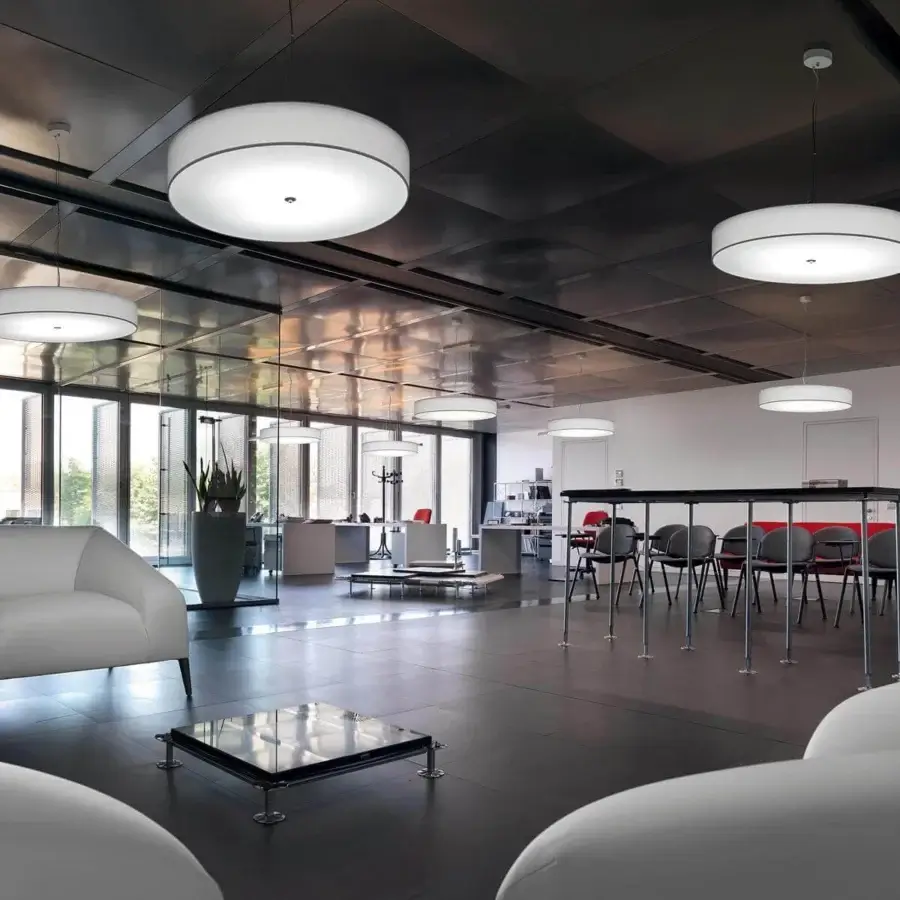 Distinguished Modo Luce Discovolante suspension lamp with a sleek cylindrical lampshade in matte white fabric and thin cable suspension