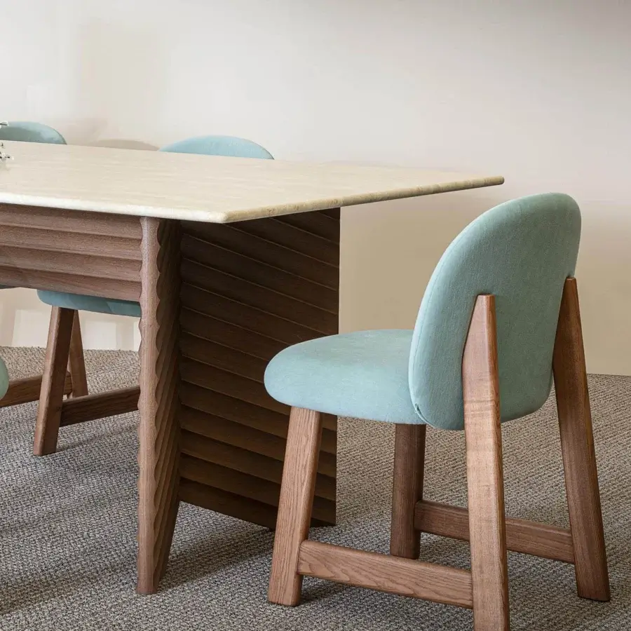Superior Moroso Rows table exhibiting linear forms with a light stone top and diagonally ribbed oak veneer base in a matte finish