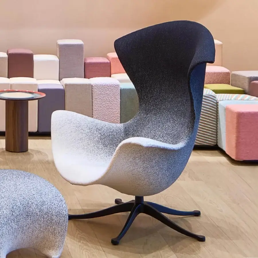 Sophisticated Moroso One Page lounge chair with gradient textile upholstery and sleek die-cast aluminum swivel base