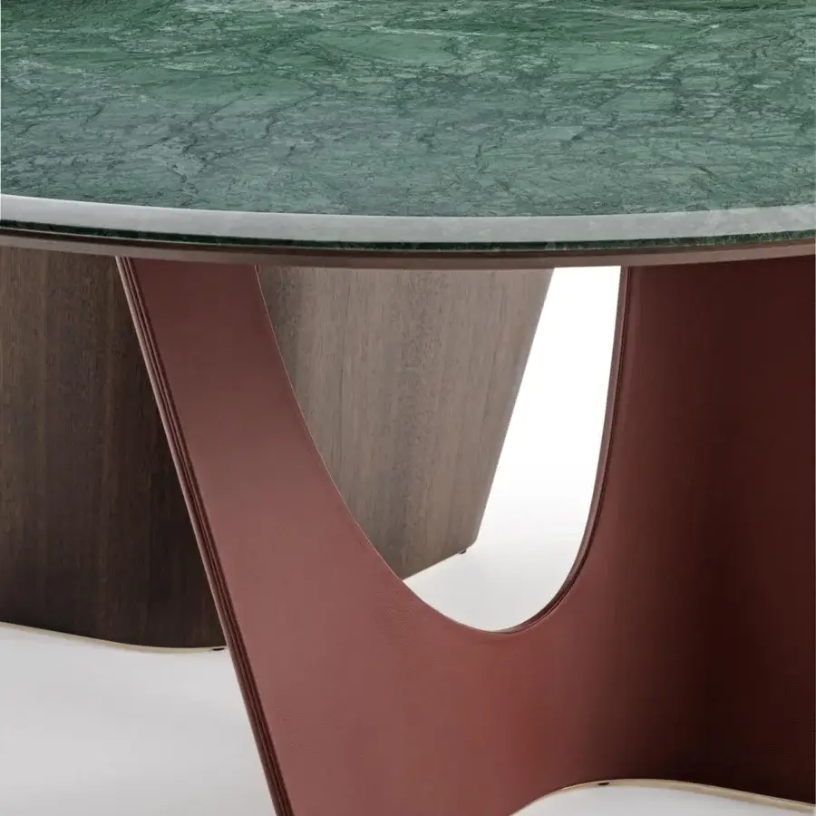 Lavish Turri Pinnacle table with a round green marble top and sculptural reddish-brown base crafted in walnut wood with glossy finish